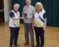 Short Mat Captain Rosemary Dunkley presents the winner's trophy to Bob Bates.